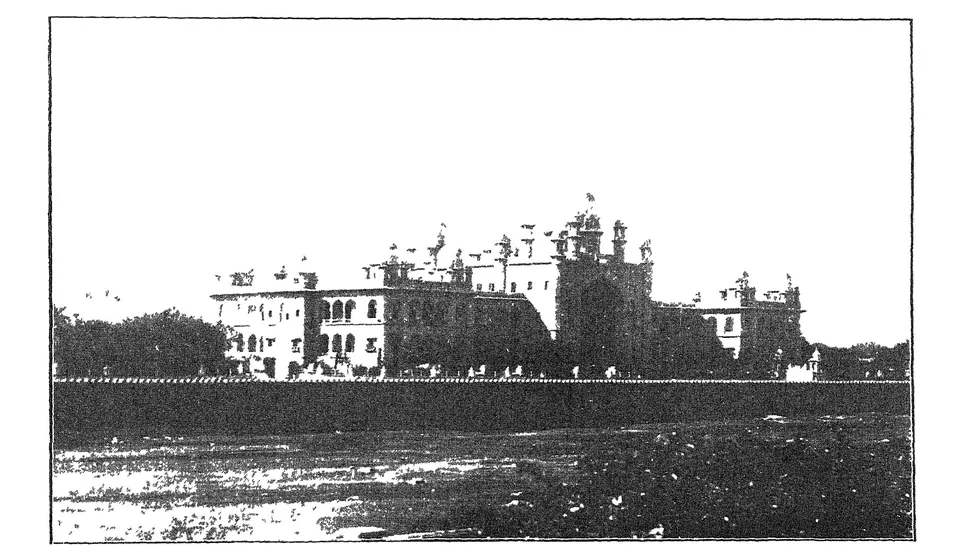Photograph of the High Court building at Hyderabad, a long building with domes and arched bays, seen across open ground.