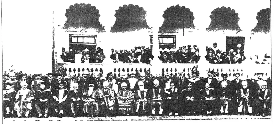 Photograph of a convocation of Osmania University: rows of seated and standing figures in gowns under an arcaded building.