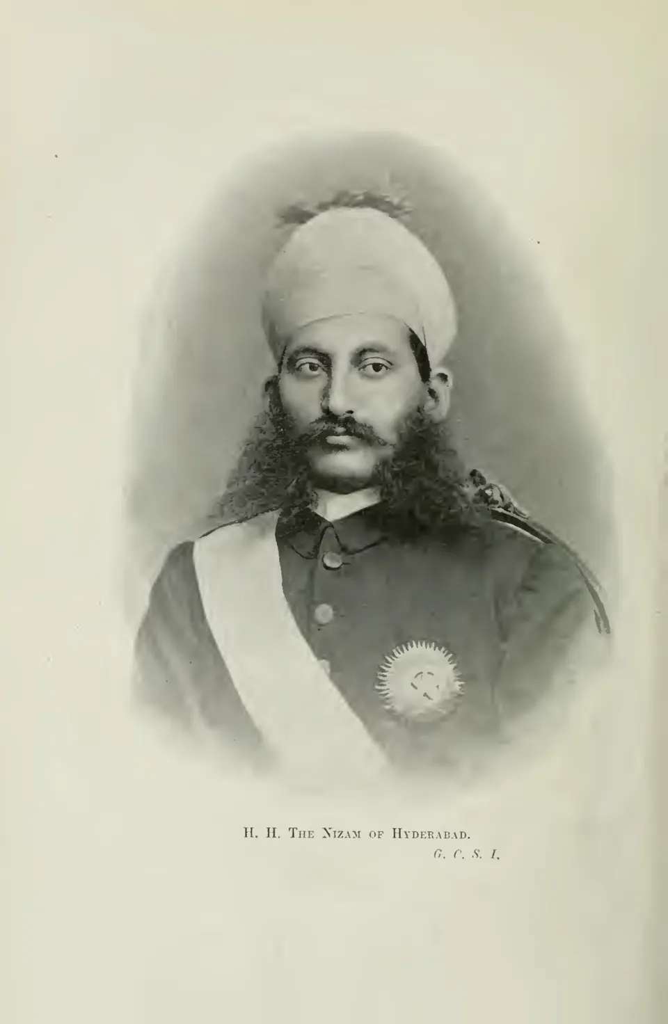 Portrait photograph of the Nizam of Hyderabad in a turban and uniform with a sash and star.