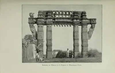 Photograph of a tall carved stone gateway (torana) standing among ruins inside Warangal fort. Printed sideways.