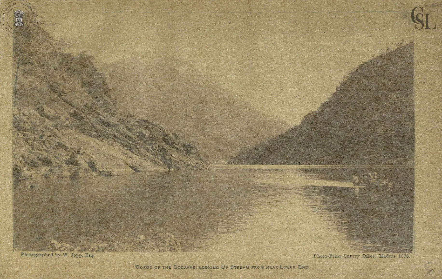 Photograph of the Godavari flowing through a gorge between steep wooded hills.