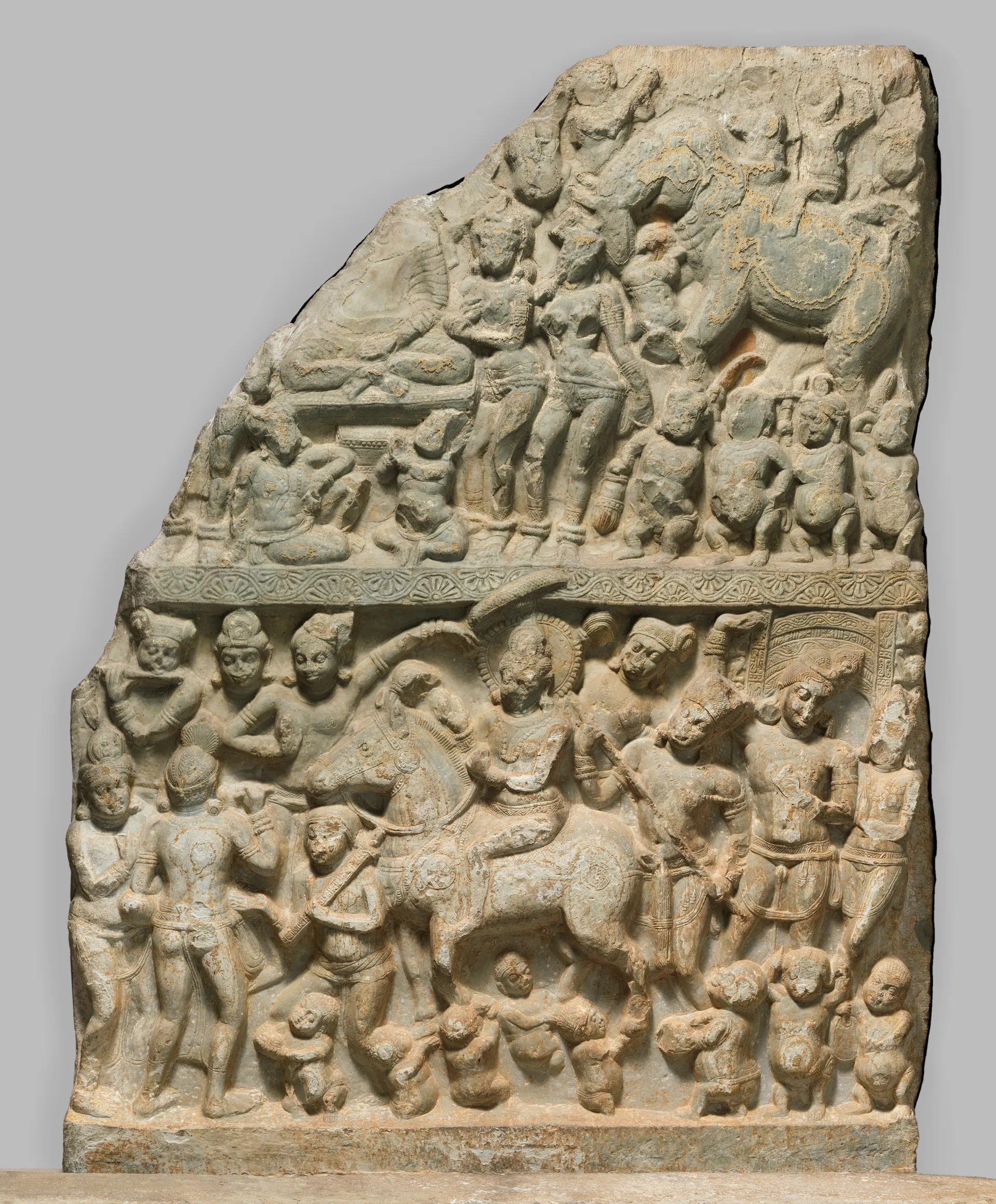 Limestone stupa drum panel from Nagarjunakonda carved in registers with the Buddha's Great Departure and the Temptation by Mara.