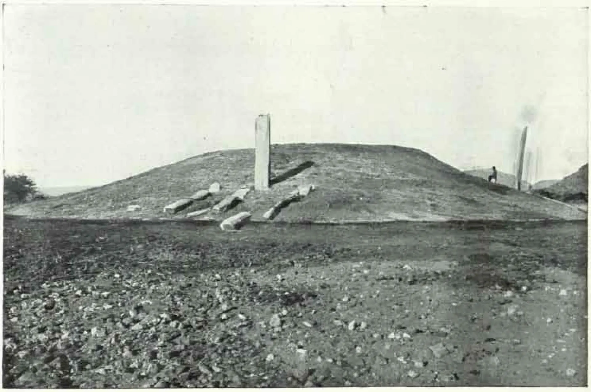 Black-and-white plate from the 1927–28 ASI report of a stupa mound at Nagarjunakonda before excavation, with standing pillars.