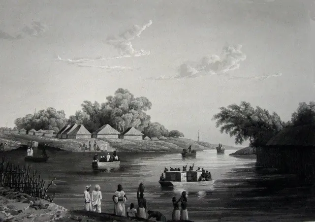 Grey engraved view across a wide river to a low bank lined with trees and houses with pyramid roofs, with small boats and a covered barge on the water and people standing on the near shore.