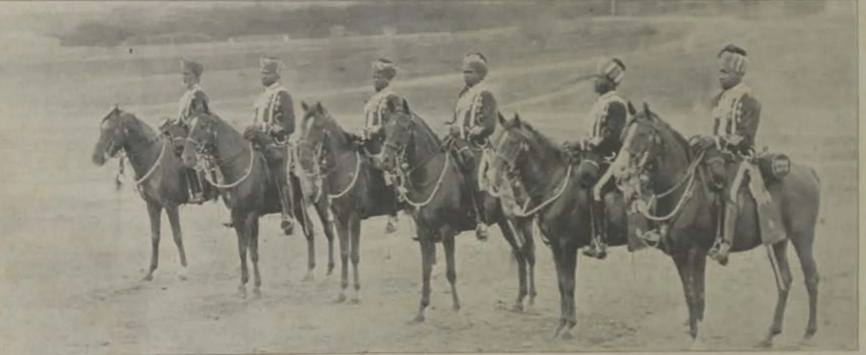 A line of mounted African guards of the Nizam on horseback.
