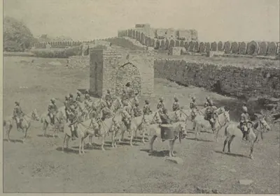 The mounted band of the Golconda Lancers riding in front of old walls.