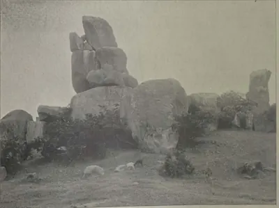 Huge granite boulders piled on one another on a bare rocky hillside near Hyderabad.