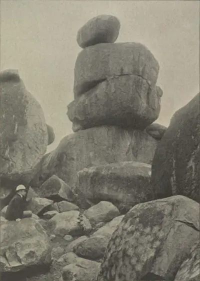 A large boulder balanced on top of a stack of granite rocks at Secunderabad.