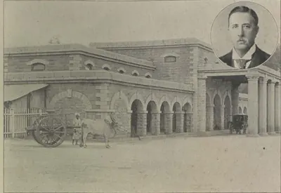 The Secunderabad railway station, an arcaded stone building with a bullock cart in front; an inset portrait of a man at top right.