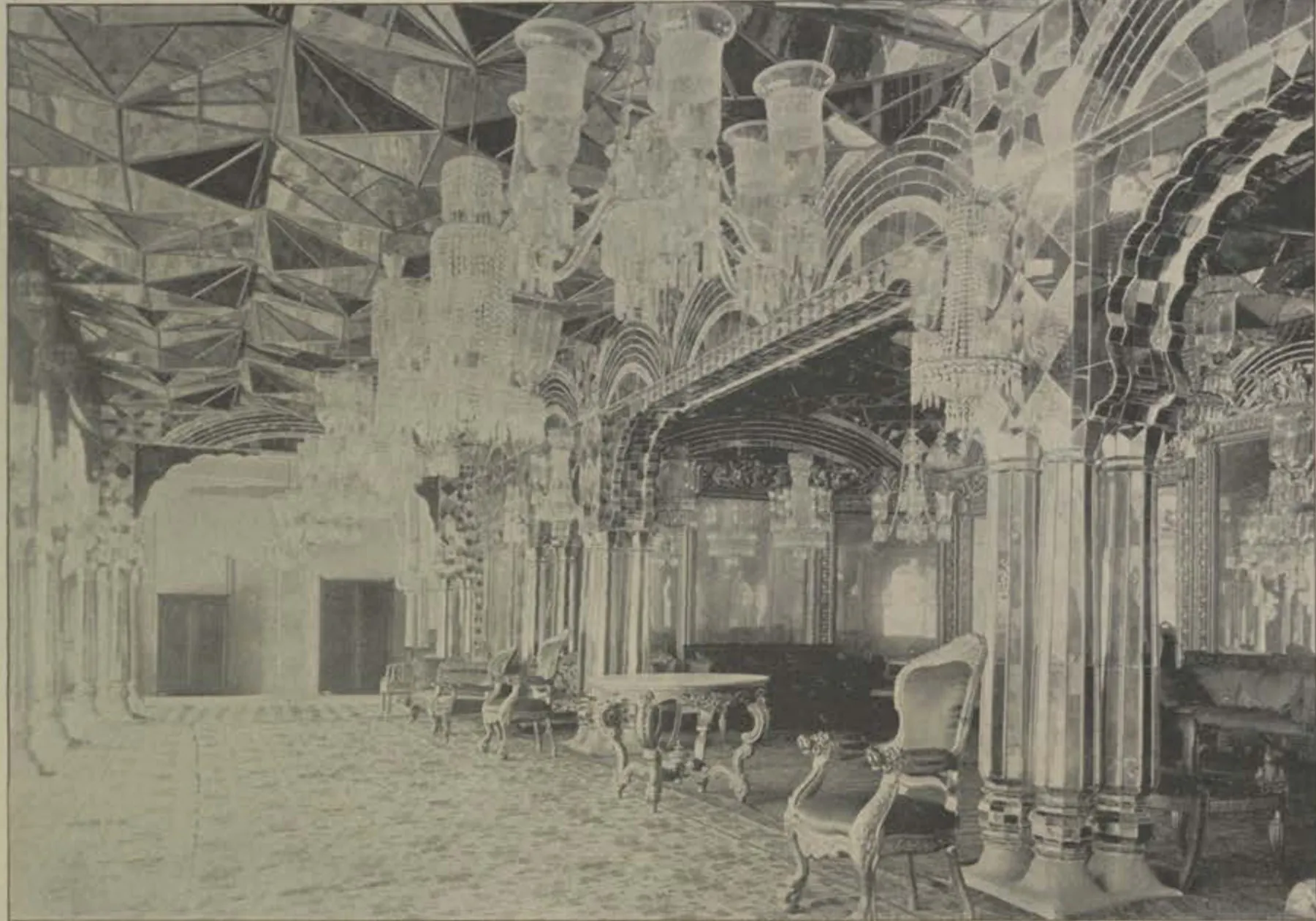 The Aina Khana, a hall with mirror-work ceilings, chandeliers and furniture.