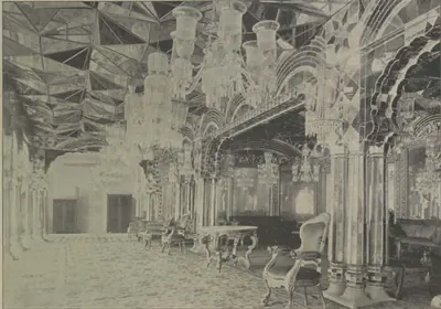 The Aina Khana, a hall with mirror-work ceilings, chandeliers and furniture.