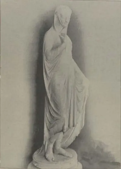 A marble statue of a veiled woman.