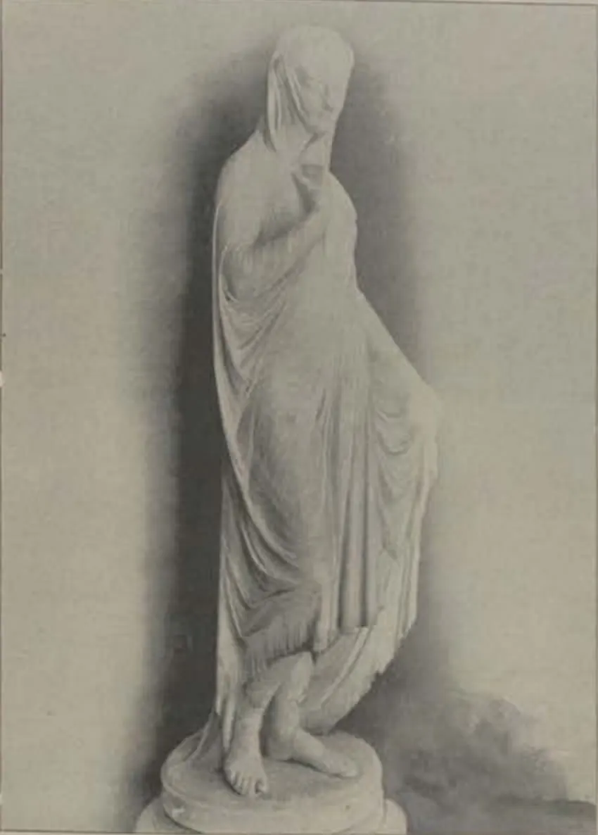 A marble statue of a veiled woman.