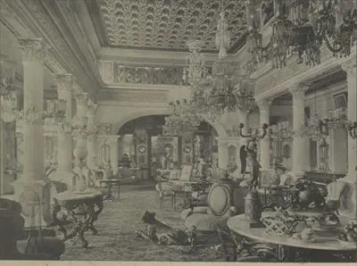 The reception room of Sir Asman Jah's city palace, with chandeliers, carpets and European furniture.