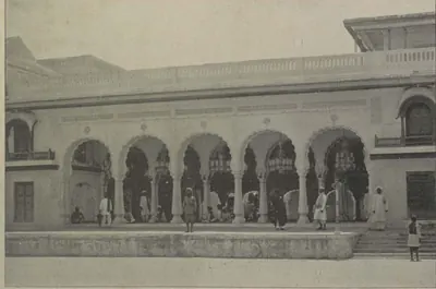 A palace front with an arcade of cusped arches.