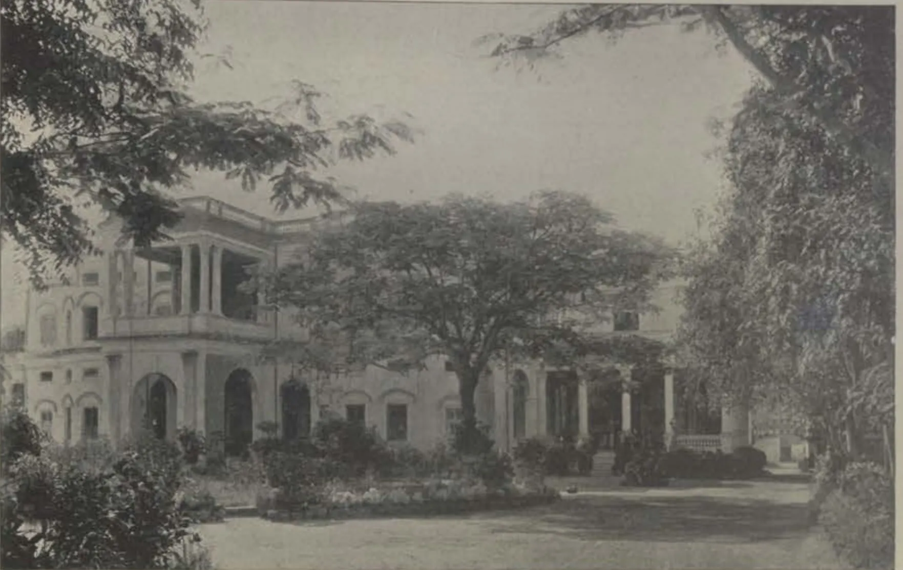 King Kothi, a building seen across a lawn among trees.
