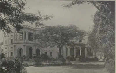 King Kothi, a building seen across a lawn among trees.