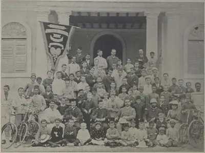The pupils of St. George's Grammar School in rows in front of the school building.