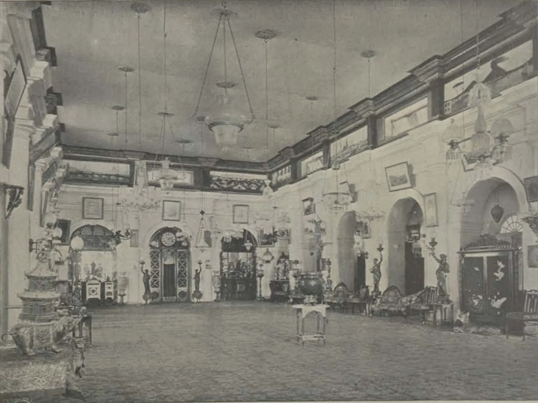 The reception room of Shapur Wadi, a long hall with chandeliers and decorated walls.