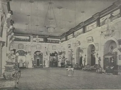 The reception room of Shapur Wadi, a long hall with chandeliers and decorated walls.