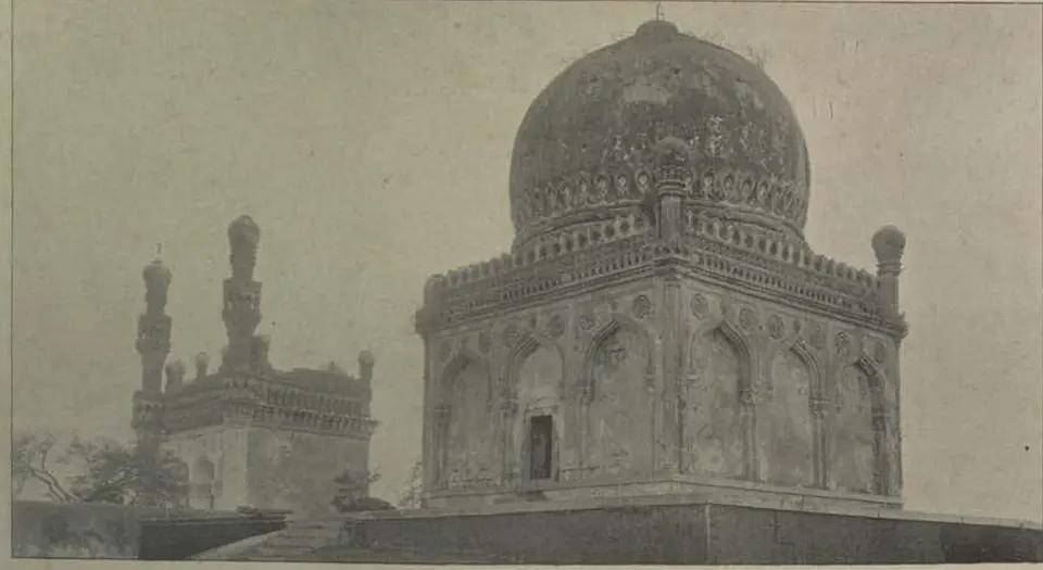 The tomb of Khairatbai, a domed tomb, with a mosque with minarets beside it.
