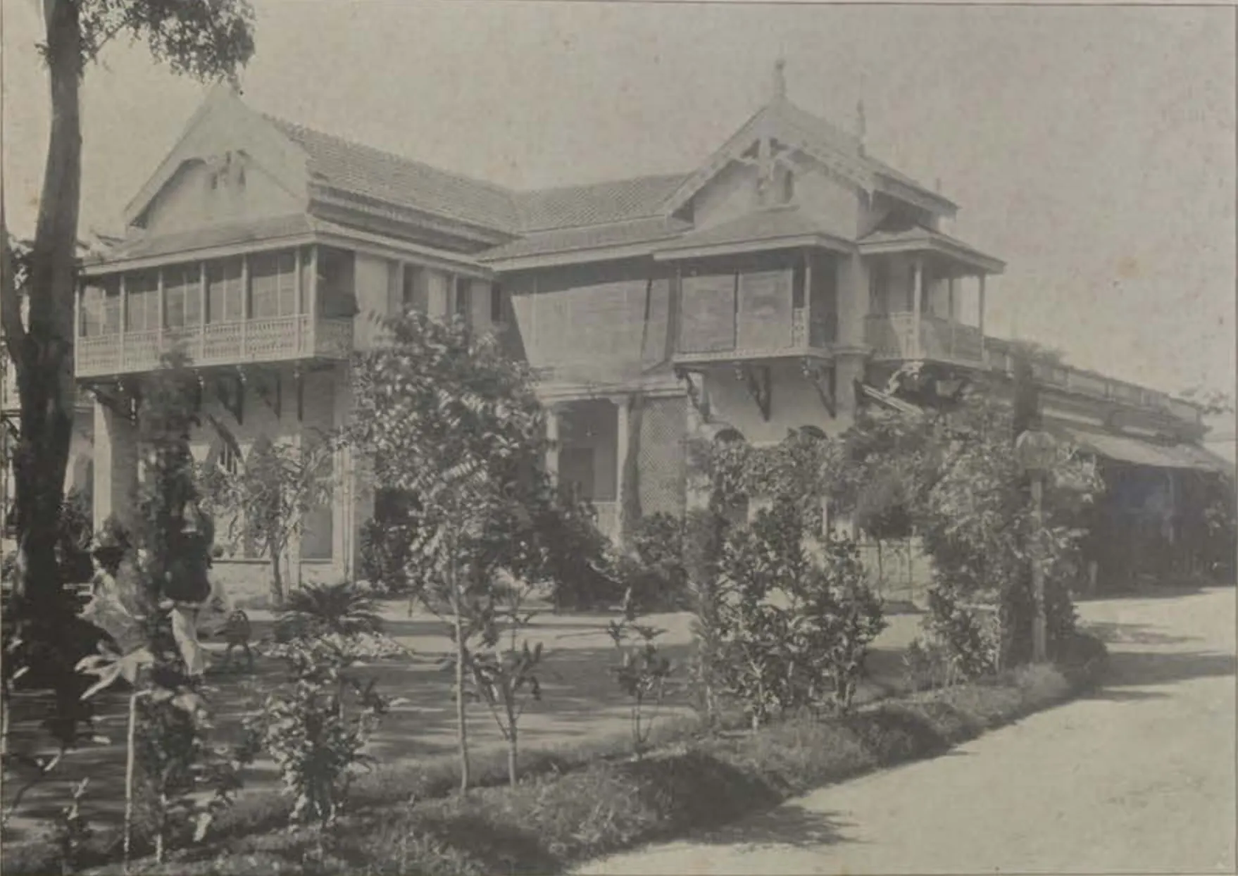 Rahat Manzil, a two-storeyed house with timber verandahs and gables.