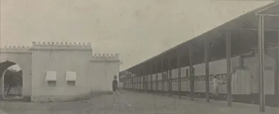 The Nizam's private railway station, a long roofed platform beside a wall.