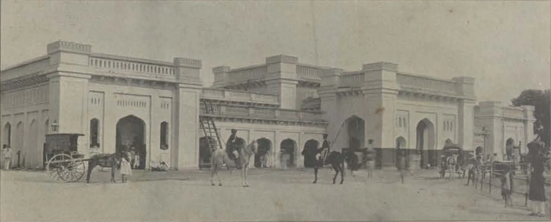 The Hyderabad railway station building, with carriages in front.
