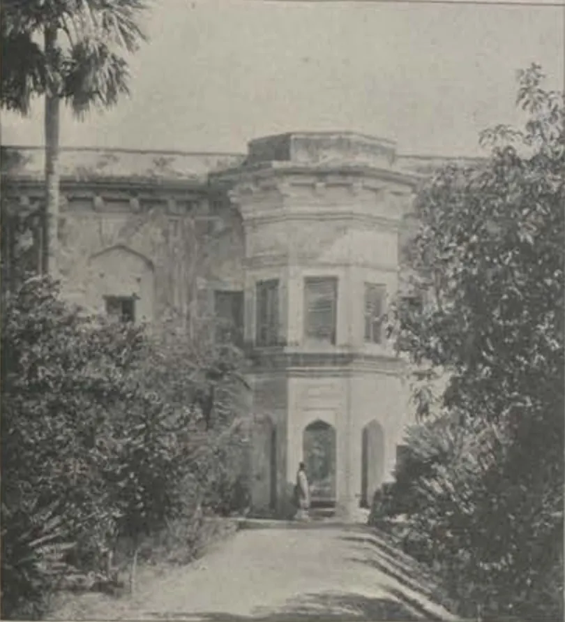 The Mushk Mahal, a two-storeyed building with a rounded bay, among trees.