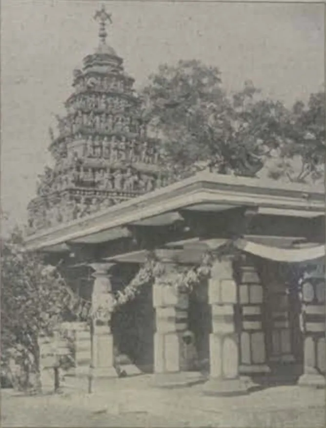A temple with a tall carved tower and a pillared hall.