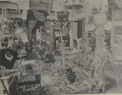 A room of the Sarurnagar palace crowded with furnishings and hangings.