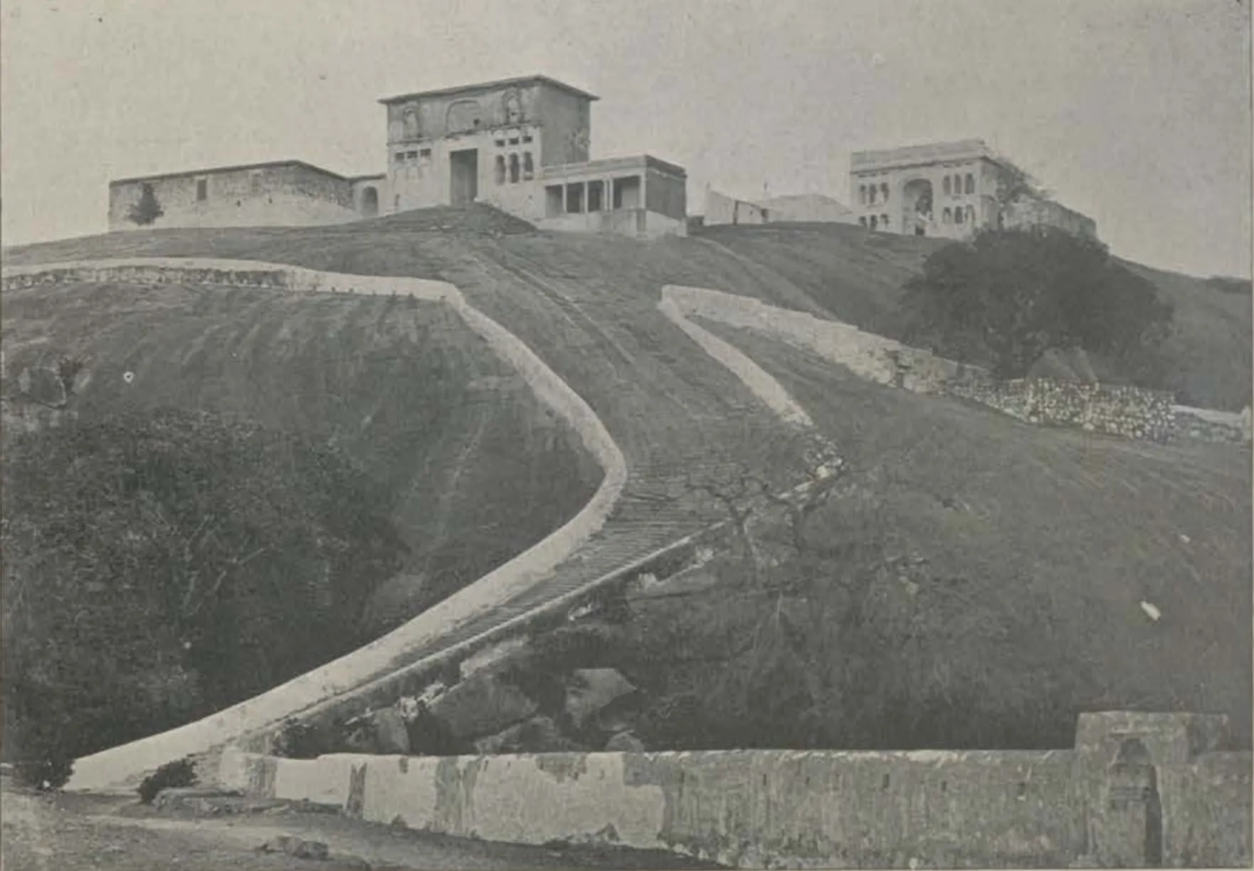 The hill of Moula Ali, with a path climbing to buildings on the top.