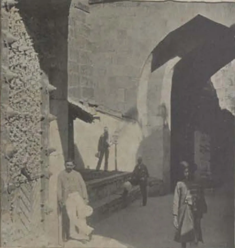 The Fateh Gate, an arched passage with men standing in it.