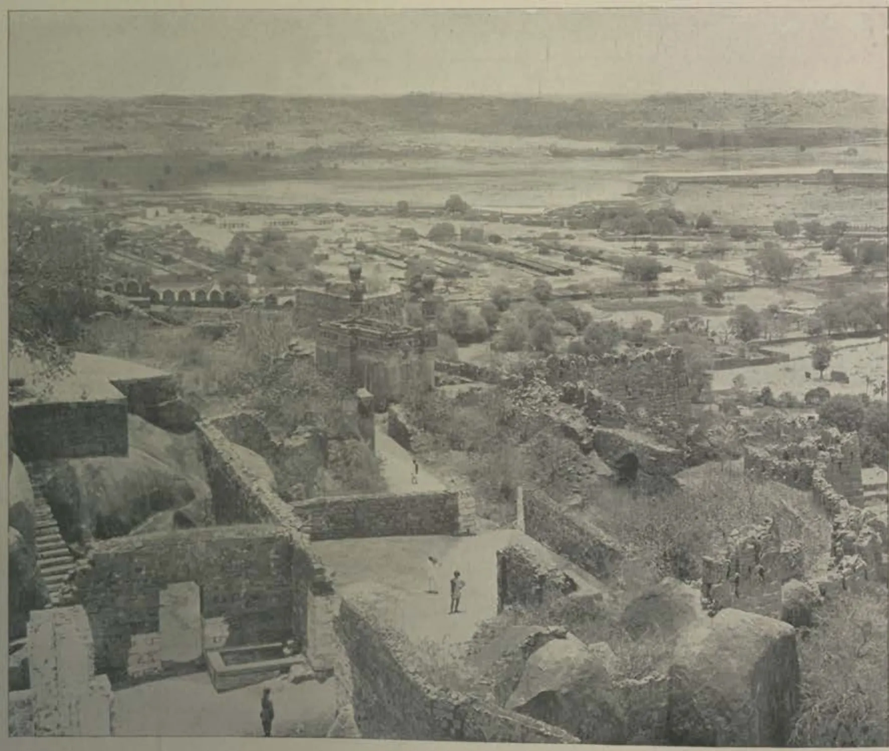 A view from the citadel over rocky ground and the plain.