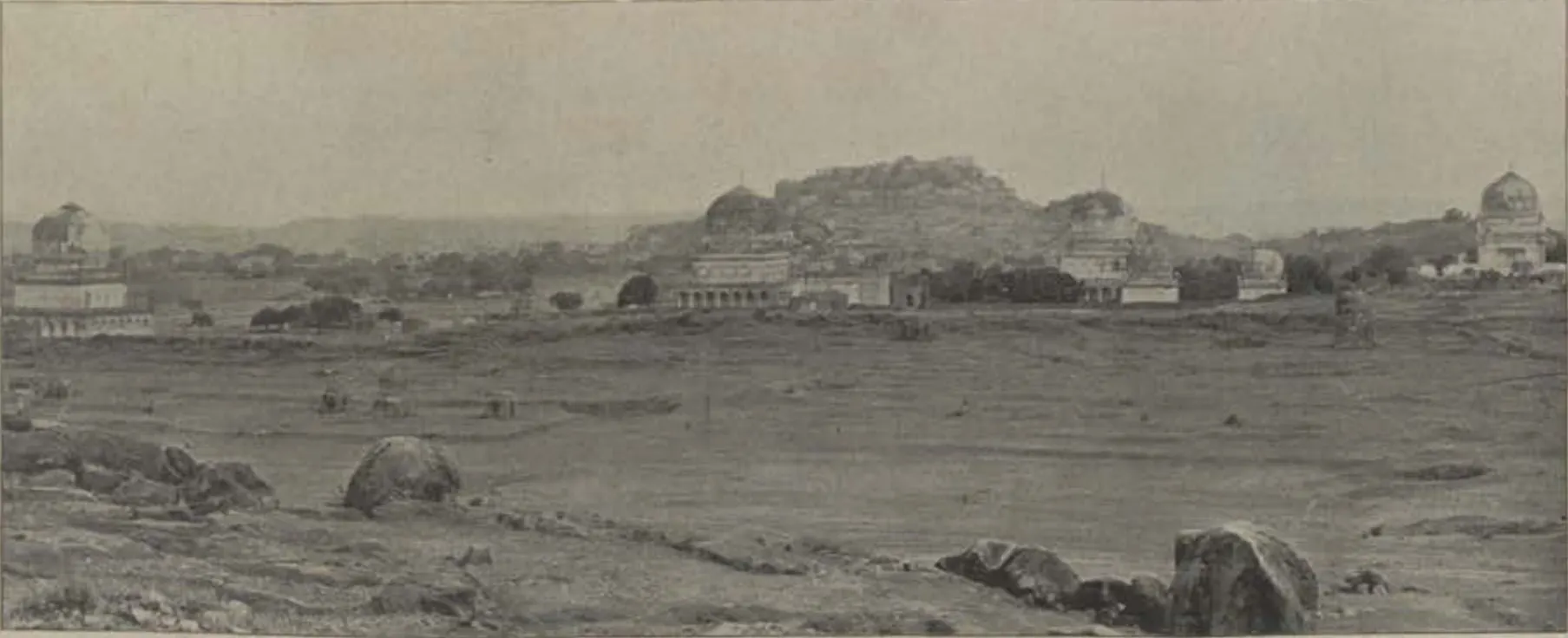 The Qutb Shahi tombs with their domes, and Golconda fort on its hill behind.