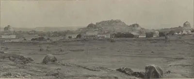 The Qutb Shahi tombs with their domes, and Golconda fort on its hill behind.