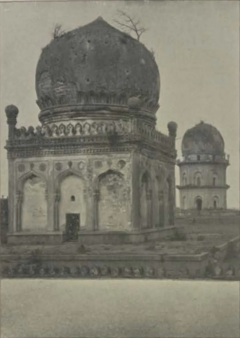 A domed tomb with a smaller domed tomb behind it.