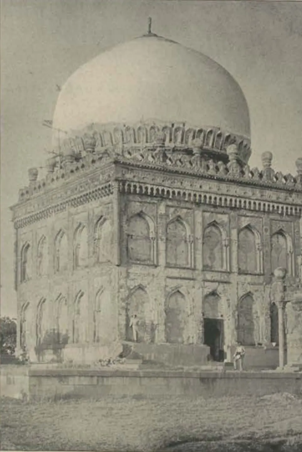 The tomb of Ibrahim Qutb Shah, a large dome over a square tomb with tiers of arches.
