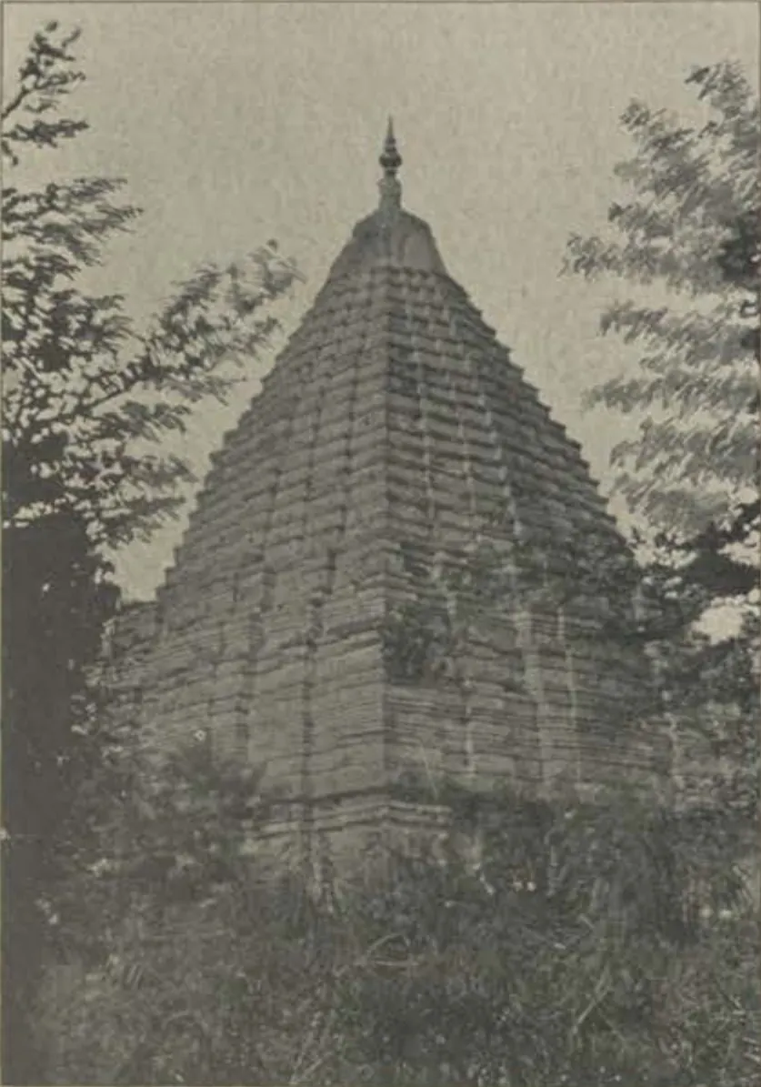 A temple with a stepped pyramidal tower, among trees.