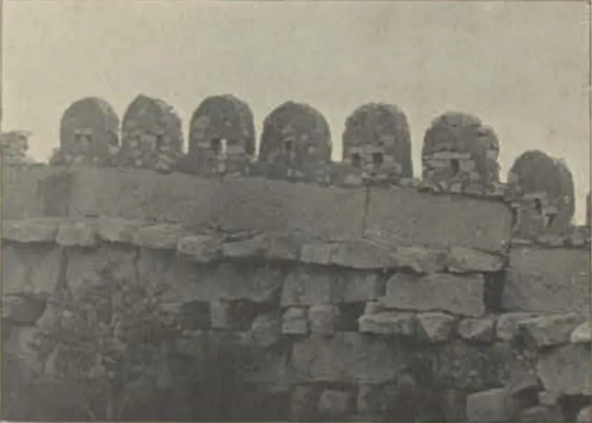 A fort wall with rounded merlons.