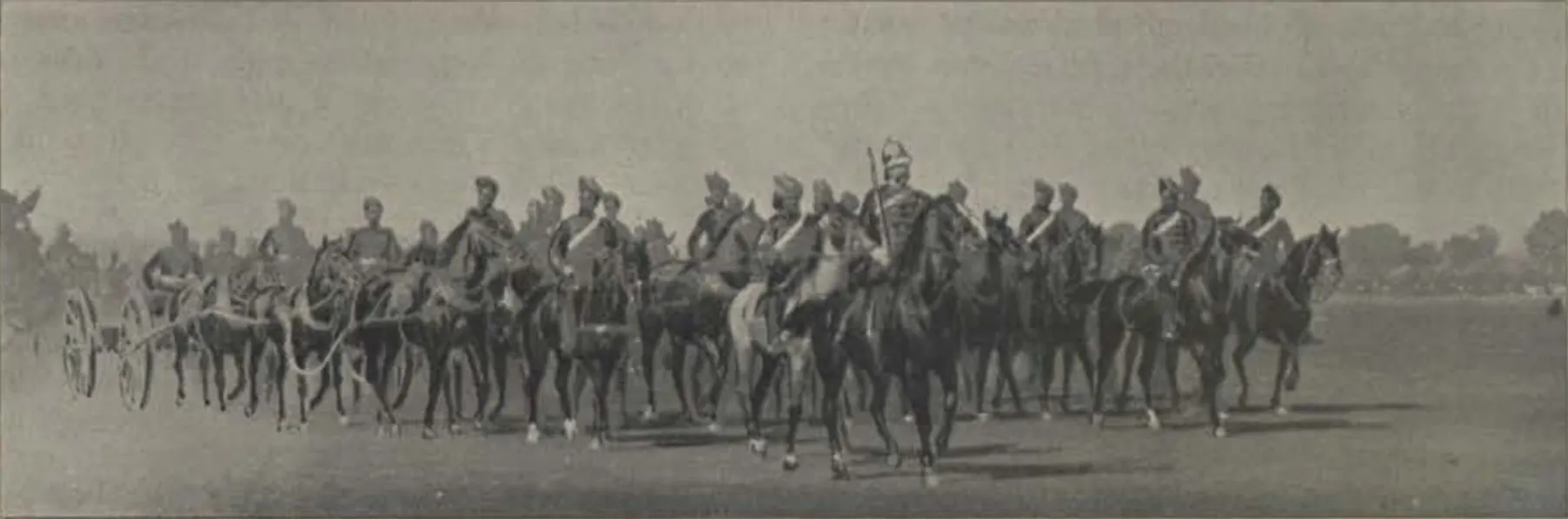 Artillery marching past at the Diamond Jubilee review in Hyderabad, with guns drawn in line.