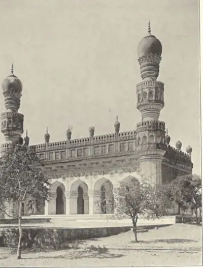 A Qutb Shahi mosque near the Golconda tombs, an arched prayer hall with two tall minarets.