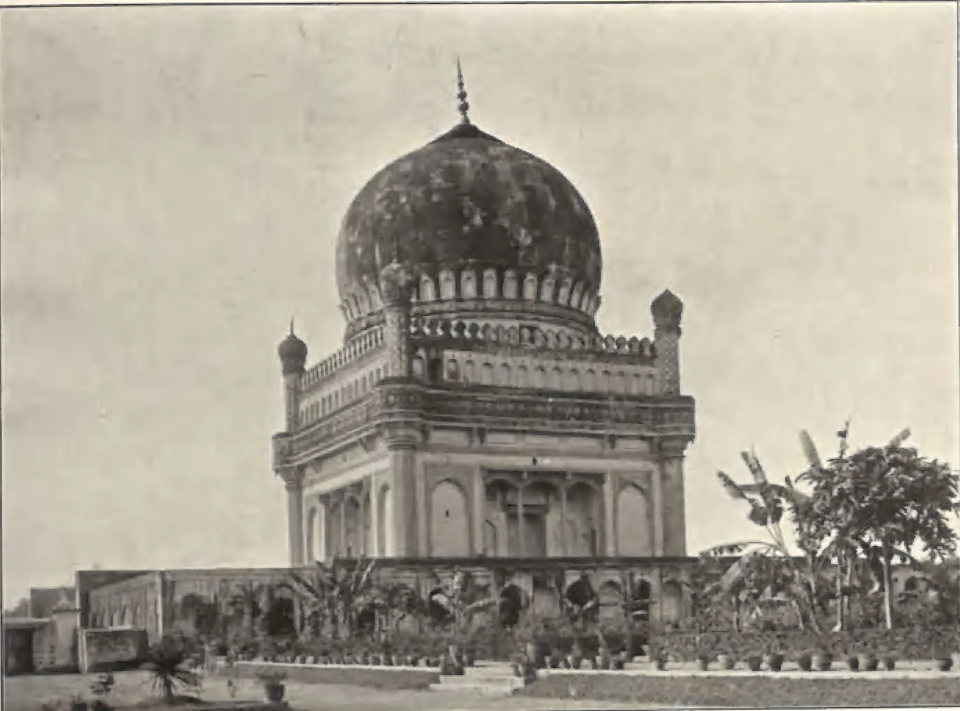The tomb of Muhammad Quli Qutb Shah, a large dome on a two-storeyed arcaded tomb, with a garden in front.