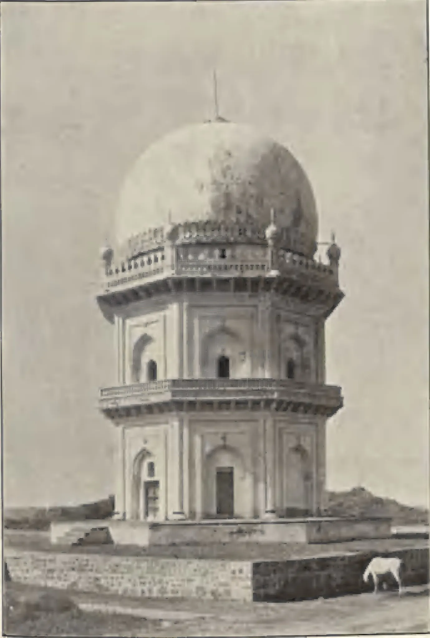 The tomb of Jamshid Quli Qutb Shah, an octagonal two-storeyed tomb with a dome, on a platform.