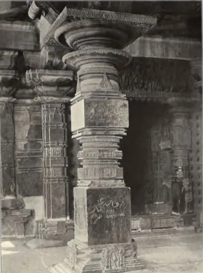 A carved pillar of the Thousand Pillar Temple, with an inscription on its square base.