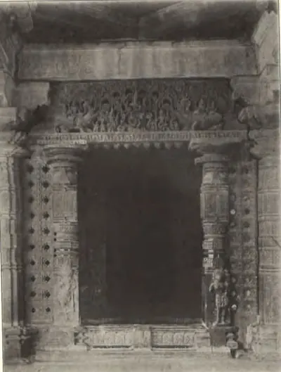 The carved door of a shrine in the Thousand Pillar Temple, with pierced screens on each side.