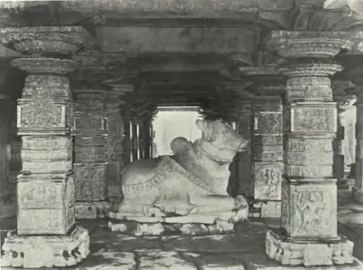 A large Nandi sitting between carved pillars in the Panchesvara temple at Panagal.