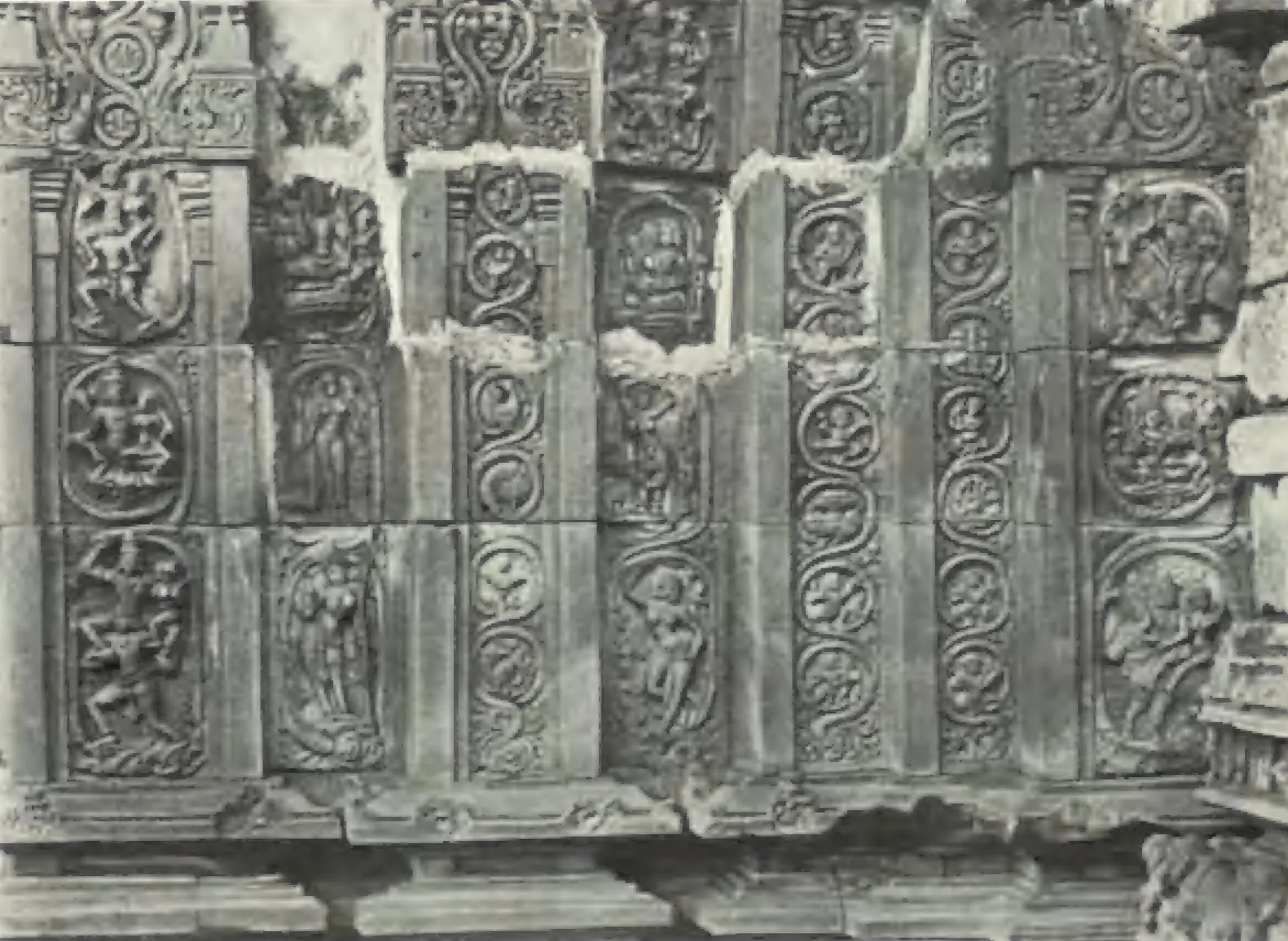Carved wall panels on the outside of the Panchesvara temple at Panagal, with figures in roundels.
