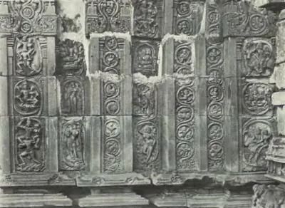 Carved wall panels on the outside of the Panchesvara temple at Panagal, with figures in roundels.