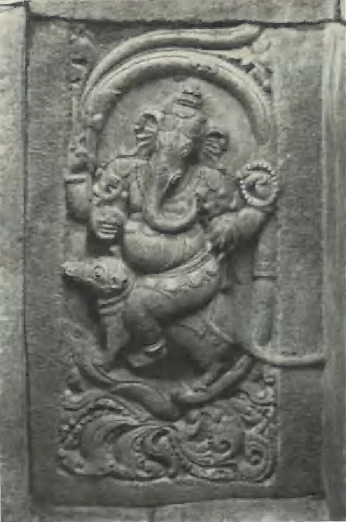 A carved panel of a dancing Ganesa standing on a lion-like animal, from the Panchesvara temple at Panagal.